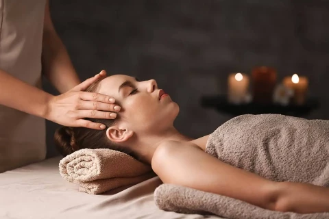 Massage service at OVYO Hotel Toulouse Centre with dim lighting, scented candles, and a massage table ready to welcome guests for the ultimate relaxation experience.